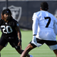 Las Vegas Raiders corner back Damon Arnette (20) and wide receiver Zay Jones perform a drill during an NFL football practice Wednesday, July 28, 2021, in Henderson, Nev.